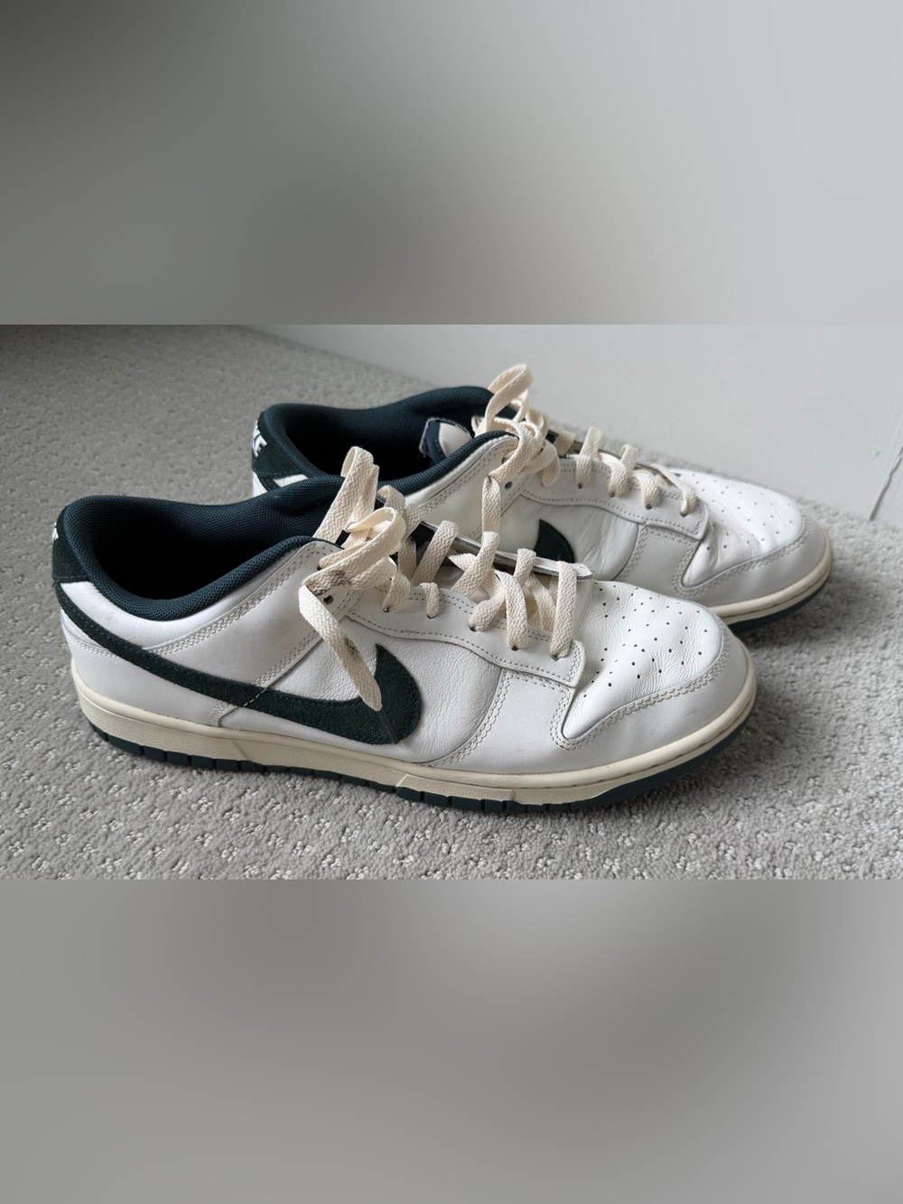 Nike White Low-Top Sneakers with Dark Green Swoosh